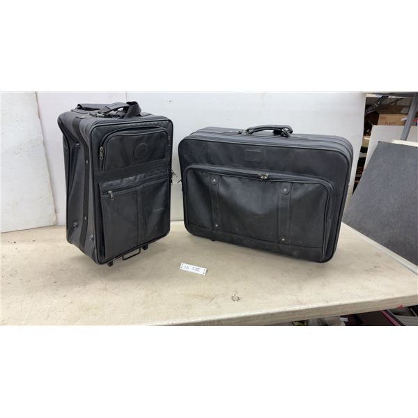 Two Black Rolling Suitcases