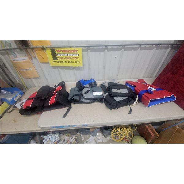 Four Personal Flotation Devices Including Oceanic and Fluid Adult Life Vests