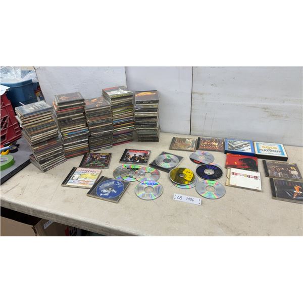 Large Collection of Rock and Pop Music CDs Including AC/DC, Aerosmith, Alice Cooper, and More