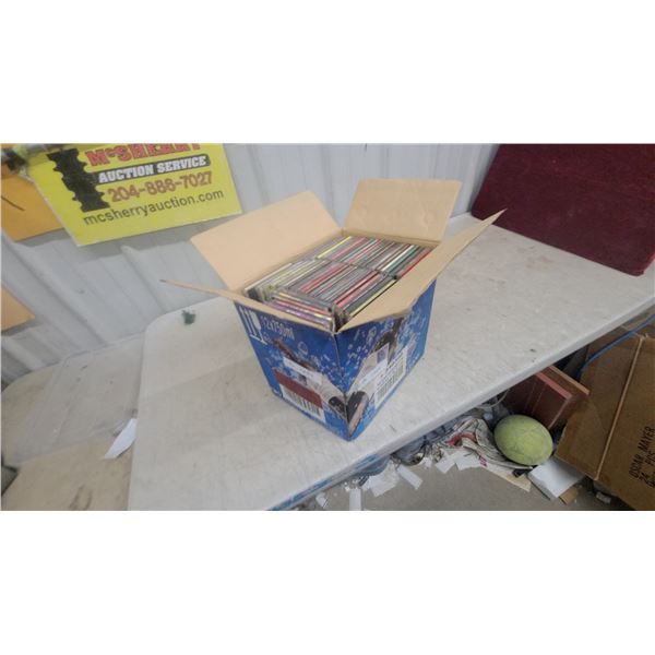 Box of Compact Discs Including Metallica, Van Halen, Saturday Night Fever, Showing Half in Photos
