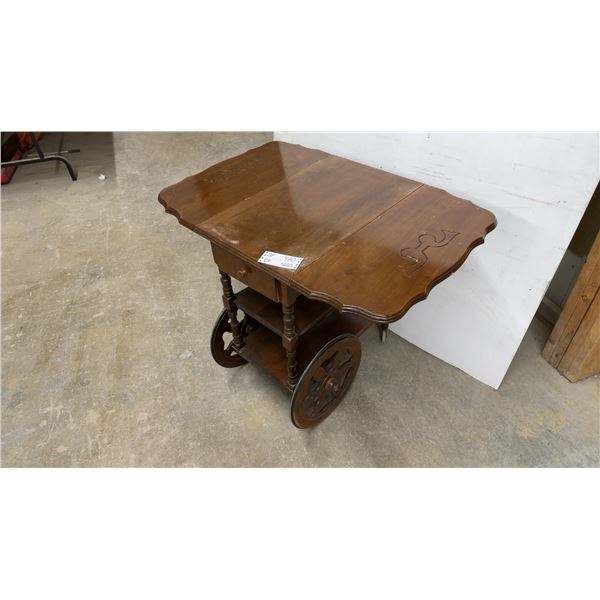 Vintage Wooden Drop-Leaf Tea Cart with Carved Scrollwork, Drawer, and Spoked Wheels 25 x 16 x 28