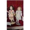 Image 3 : Four Porcelain Collector Dolls with Period-Style Clothing, Stands, and Stuffed Duck