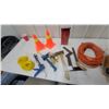 Image 1 : Orange Traffic Cones, Caulk Guns, Hatchet, Screwdrivers, Extension Cord, Yellow Rope, and More