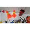 Image 4 : Orange Traffic Cones, Caulk Guns, Hatchet, Screwdrivers, Extension Cord, Yellow Rope, and More