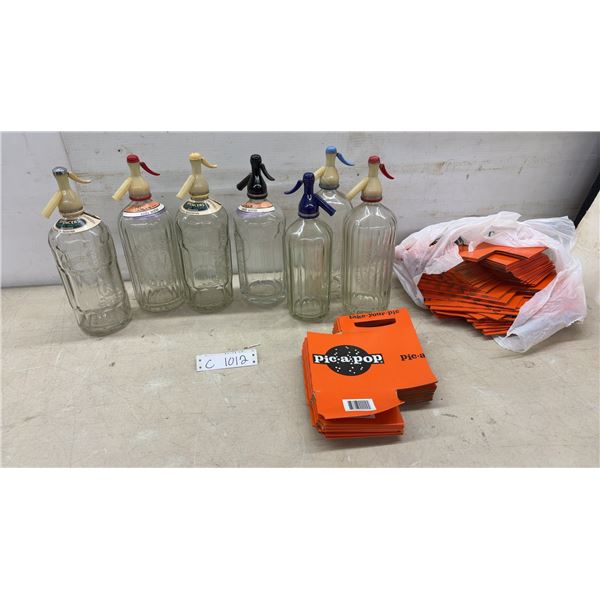 Collection of Vintage Glass Soda Siphon Bottles and Pic-A-Pop Cardboard Packaging Sleeves