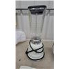 Image 2 : Vintage Osterizer Blender with Glass Jar, Juicer Attachment, Discs, and More