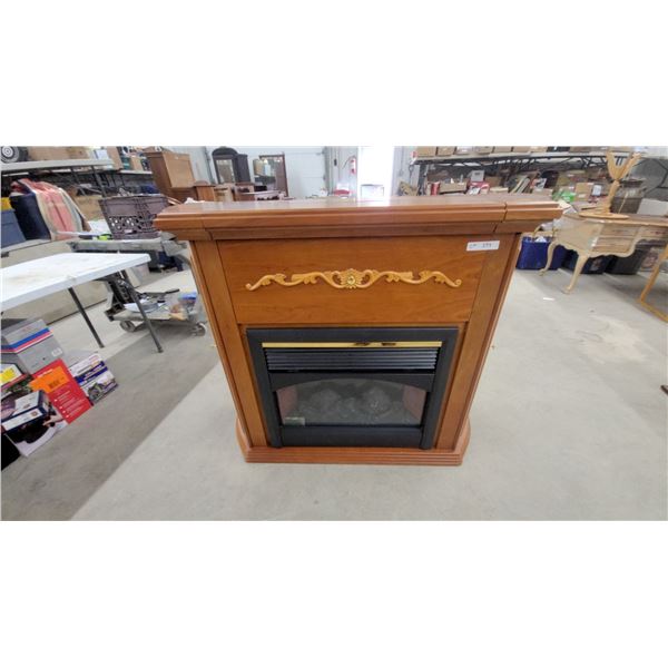 Electric Fireplace Mantel with Cherry-Tone Wood Cabinet and Decorative Carved Scrollwork with