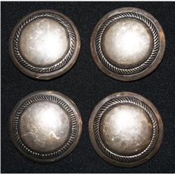 four Navajo buttons