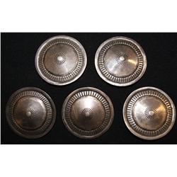 four Navajo buttons