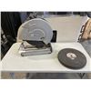 Image 1 : PREMIUM BRANDS CUT OFF SAW AND STACK OF REPLACEMENT CUT OFF DISCS