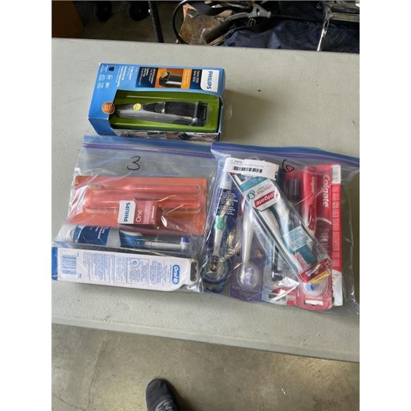 2 BAGS OF NEW TOOTHBRUSHES AND PHILIPS RAZER