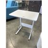Image 5 : WHITE ADJUSTABLE HEIGHT TABLE AND WHITE STORAGE ATTOMAN