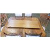 Image 2 : ANTIQUE OAK DINING TABLE WITH ORIGINAL PORCELAIN WHEELS AND 6 DINING CHAIRS WITH EXTENSION LEAF