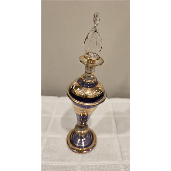 04 - Decorative Egyptian perfume bottle with glass stopper. Probably mouth-blown galss.  Purple with