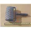 Image 1 : Spiked roller, specifically used for concrete and flooring applications.