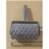 Image 2 : Spiked roller, specifically used for concrete and flooring applications.