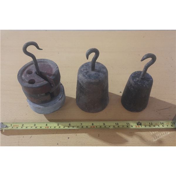 Vintage cast iron hanging scale weights.