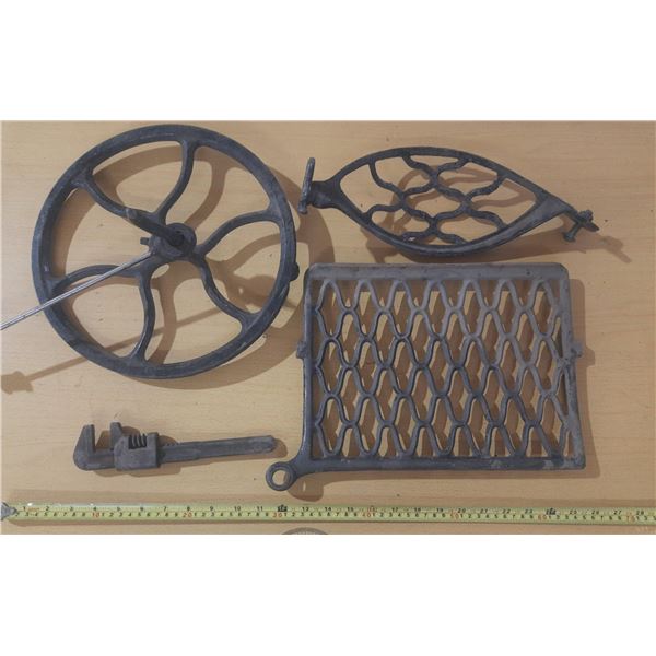 Antique cast iron parts for a Singer treadle sewing machine.