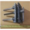 Image 1 : Woodworking bench vise, a heavy-duty tool designed to securely hold workpieces during tasks like cut