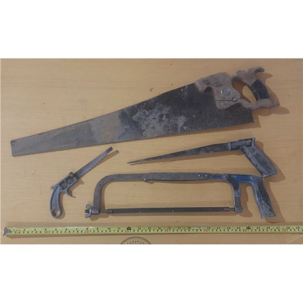 Vintage hand saws of different sizes.