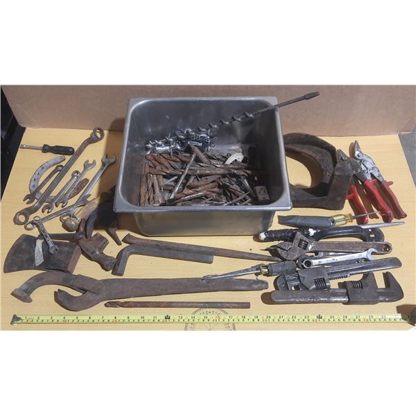 Vintage hand tools lot featuring a variety of wrenches, a hole punch, and drill bits.