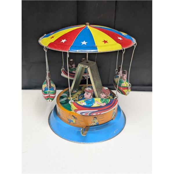 Vintage Made in China Tin Working Merry Go Round Toy