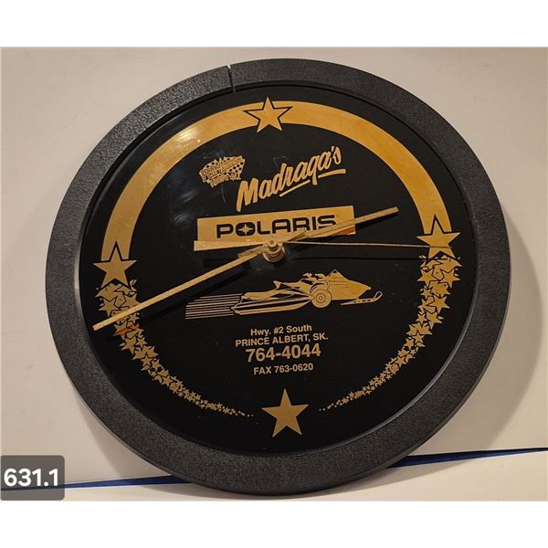 631. Polaris glass Snowmobile advertising clock - 10 1/2 inches across, works
