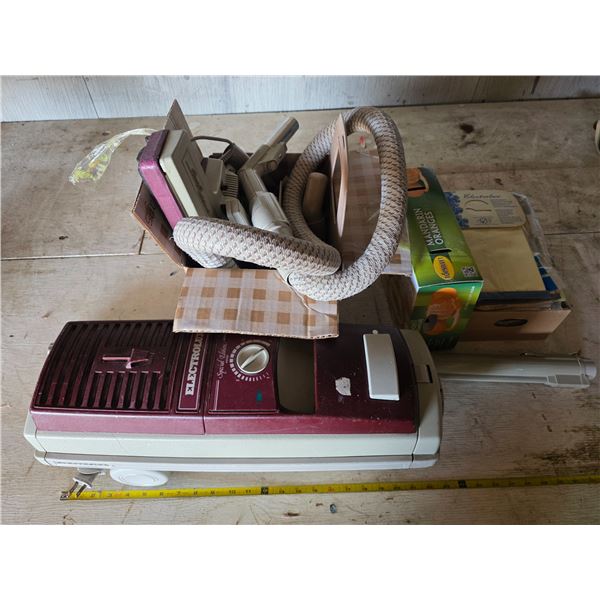 Vintage Electrolux vacuum with extra bags and parts- untested