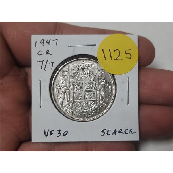 1947 Curved Right 7 with 7 Over 7 Canadian Silver 50 Cents. VF30. Scarce.