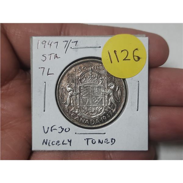 1947 Straight 7 Left with 7 Over 7 Canadian Silver 50 Cents. VF30. Nicely Toned. Scarce.
