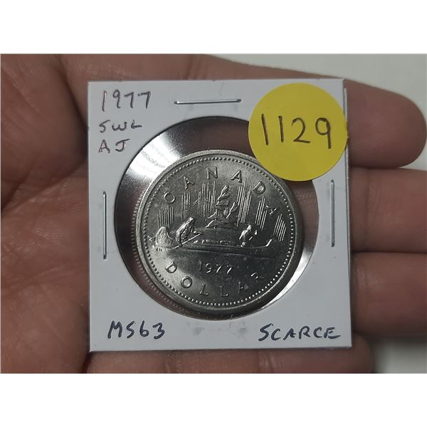 1977 Short Water Lines Canadian Nickel Dollar. Attached Jewels. MS63. Scarce.