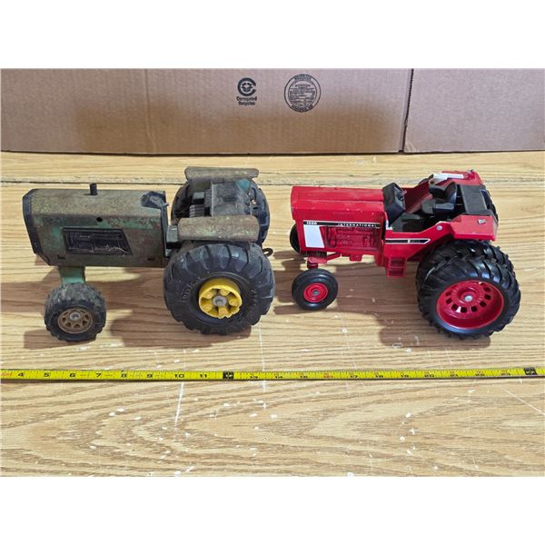 2 toy tractors- 1 is IH
