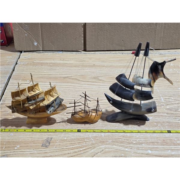 3 boat statues- made from various materials