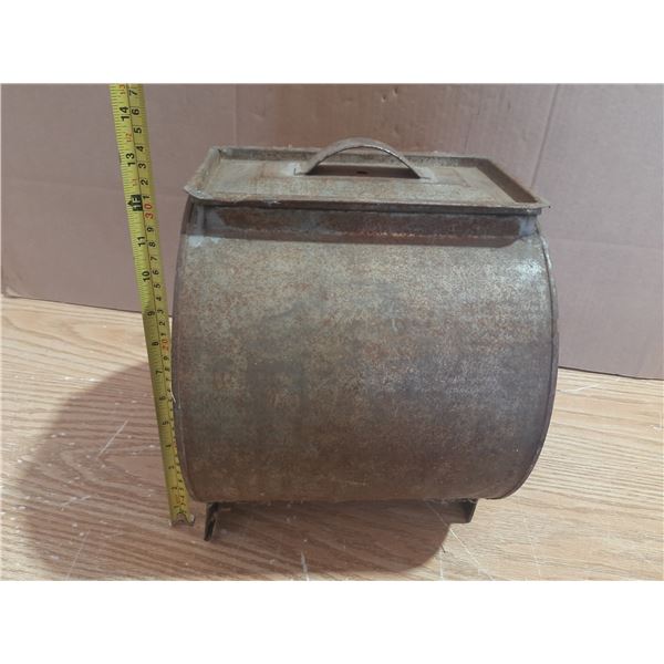 Antique metal butter churn.