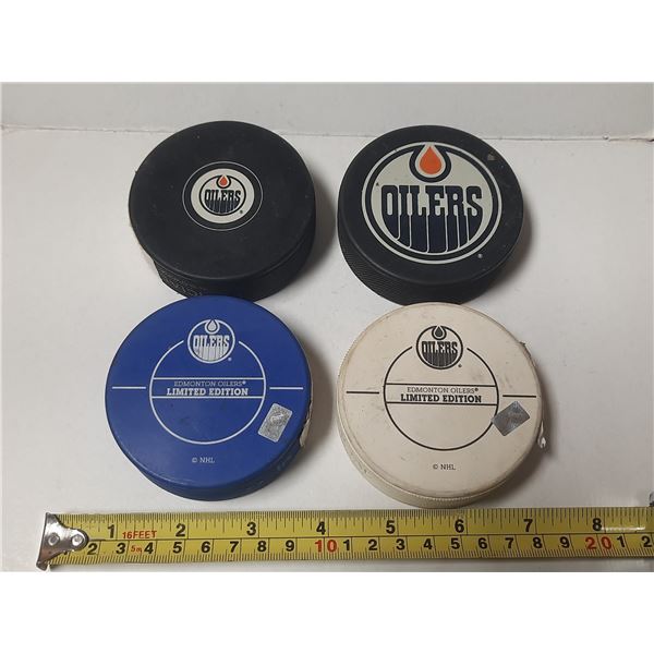 (4) Edmonton Oilers Hockey Puck. (Two are limited editions blue and white)