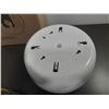 Image 5 : White wall-mounted center-feed roll paper dispenser featuring a central black panel for easy paper d