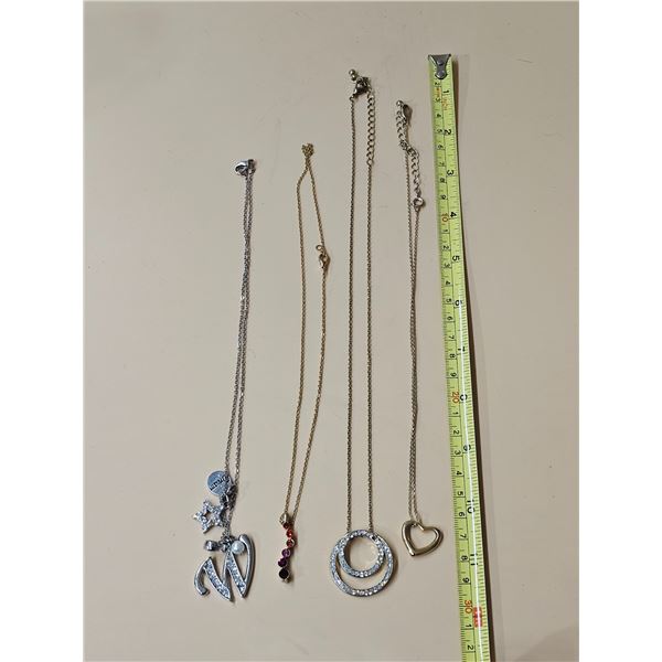 (4) 8” Necklaces w/ Pendants.  (1) Silver Tone, (3) Gold Tone