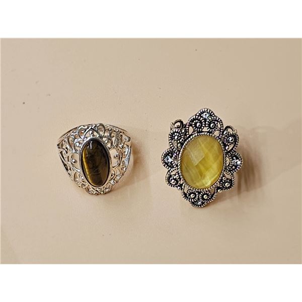 (2) Rings.  Yellow Stone (Size 6).  Brown Stone (Size 7)