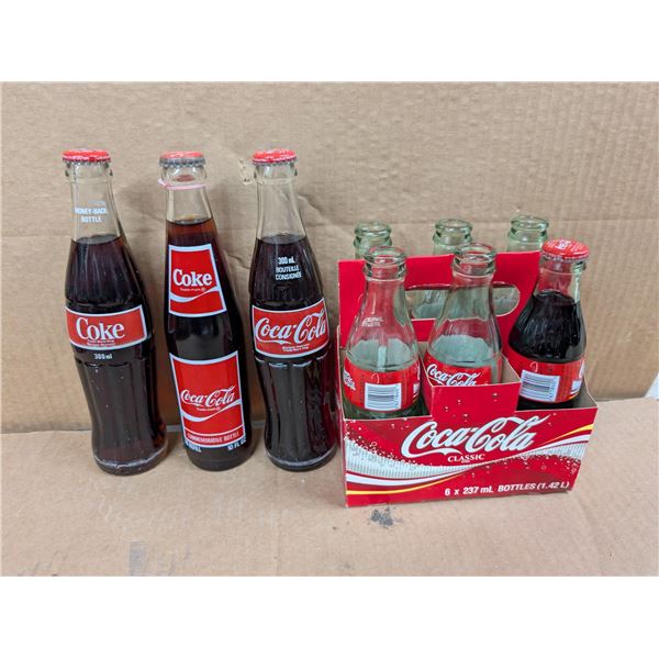 (4) Sealed Vintage Coke Bottles (5) Empty Bottles Coke