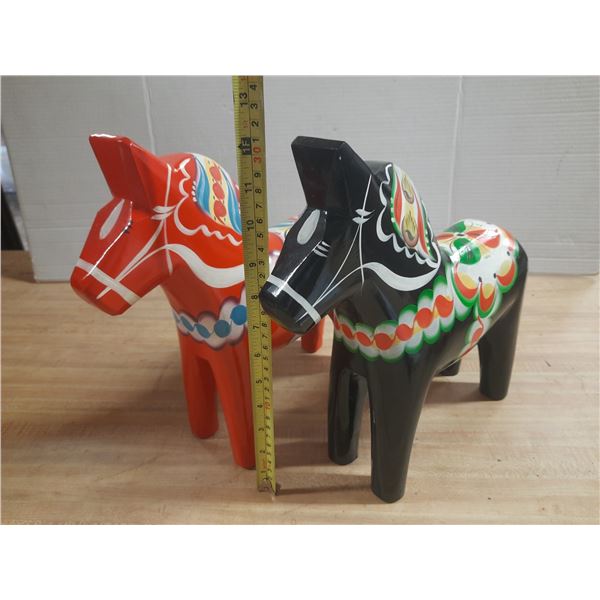 Traditional Handcrafted Swedish Dala Horse Figurines Painted Inn Red And Black with intricate folk a