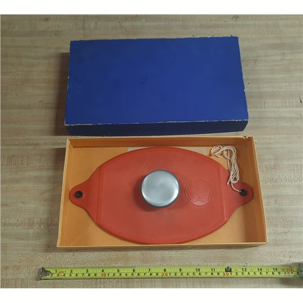 Vintage red rubber medical ice caps, often referred to as oval ice bags.