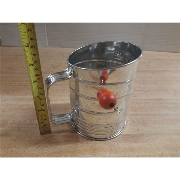 Vintage Bromwell's flour Sifter featuring a distinctive red wood knob on the hand crank.