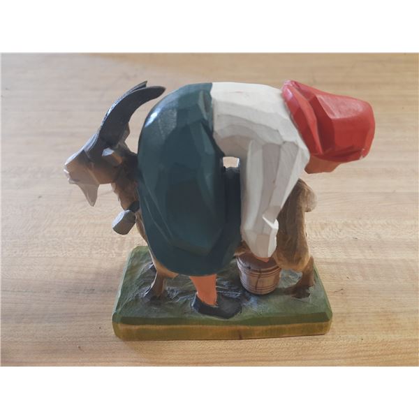Vinatge Henning Norway handcrafted wooden figurine of a woman milking a goat