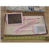 Image 3 : Vintage Carzol plastic vanity set including a pink brush, mirror, and comb.