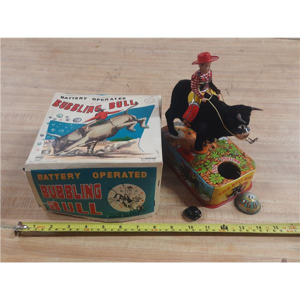 Vintage Linemar "Bubbling Bull" battery-operated tin toys, including the original box and "Wild West