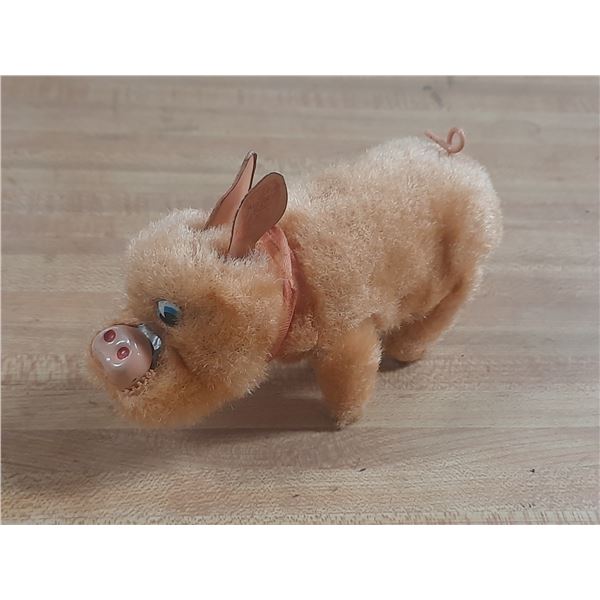 Vintage wind-up "Sniffing Rooting Pig" toy, manufactured in Japan by TN (Toys Nomura) during the 195