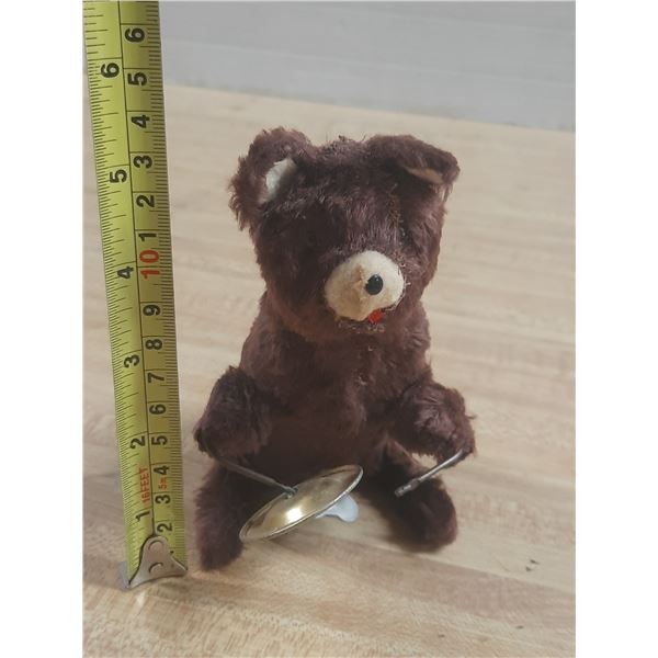 Vintage wind-up plush toy bear holding cymbals, likely manufactured in Japan during the mid-20th cen