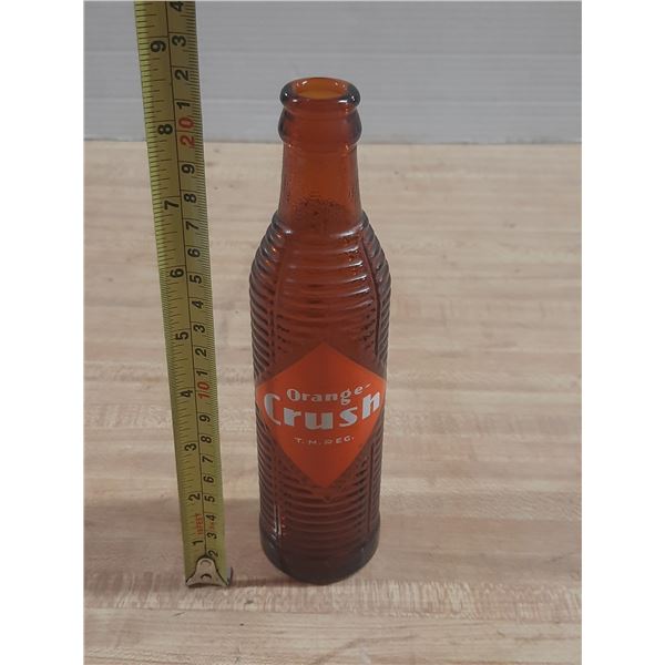 Vintage Orange Crush soda bottle from the 1930s to 1950s.