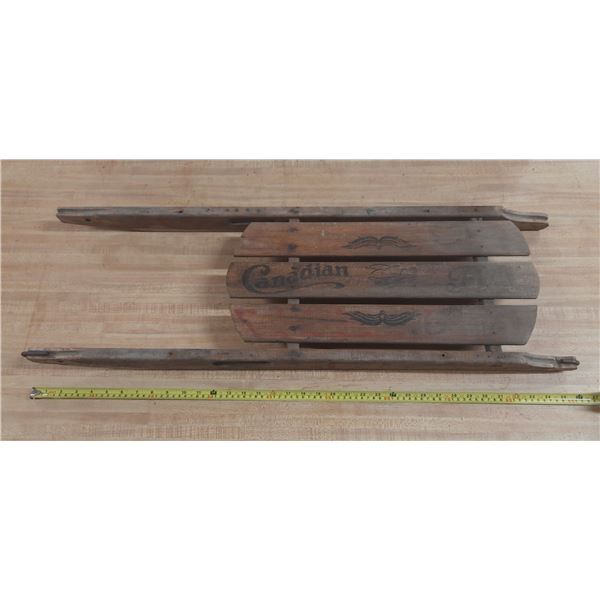 Vintage Canadian Flyer wooden and metal rail sled. (35" X 11" X 3")