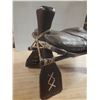 Image 10 : Vintage Middle Eastern or African camel saddle stool, featuring a dark brown leather seat and a carv